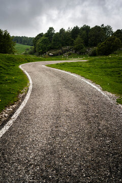 Italy, Province of Verona, Verona, Winding country road in Italian Alps