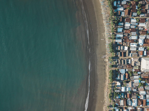 Indonesia, Sumbawa Island, Maluk, Aerial view of coastal town, beach