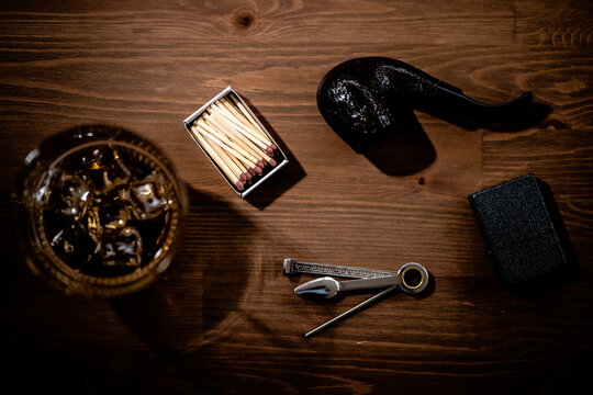 Matchbox, glass of whiskey, smoking pipe and 3-in-1 Czech tool