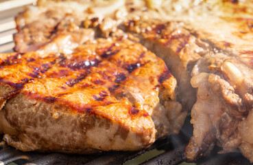 Tasty rib-eye steak cooked on an electric plate. Close view on meat