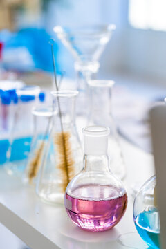 Beakers containing chemical solution kept on lab table