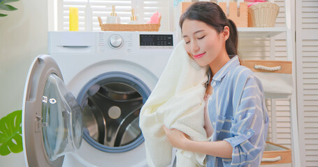 Asian housewife wash clothes