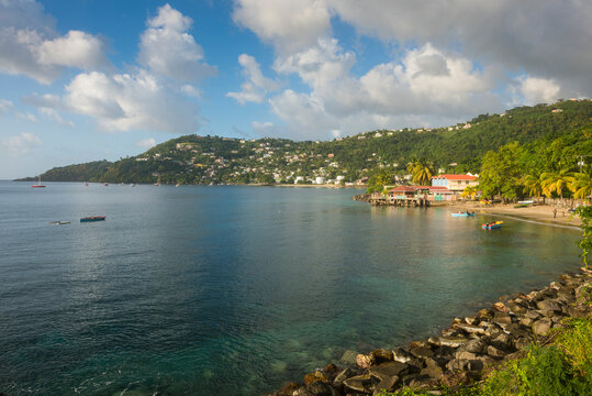 View of Grand Mal Bay by mountain against cloudy sky, Grenada, Caribbean