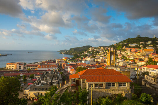 Aerial view of St. George's town by sea against sky at sunset, Grenada, Caribbean