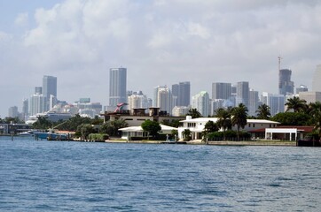View of RivoAlto island homes in `Miami Beach,Florsida against a background of the tall building skyline in downtown `Miami.