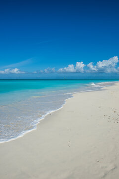 Scenic view of Grace Bay beach against blue sky, Providenciales, Turks And Caicos Islands