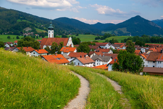 Germany, Bavaria, Hausham, Tire tracks in front of countryside town