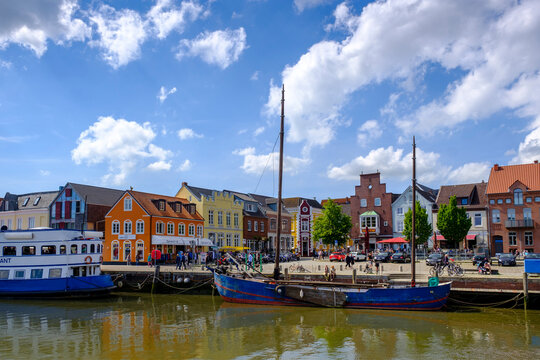 Germany, Schleswig-Holstein, Husum, Sailing ship moored in town harbor