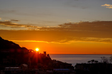 Italy, Liguria, Riviera di Ponente, Finale Ligure, Town and sea at sunrise