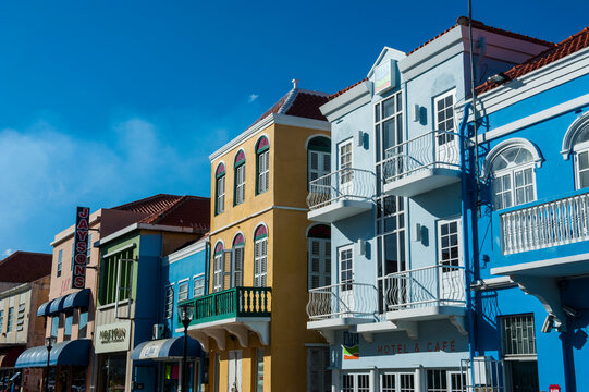 Low angle view of colorful buildings against blue sky in Willemstad during sunny day, Cura&Ocirc;&oslash;&Omega;ao