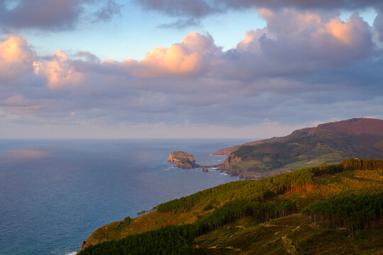 Spain, Biscay, Bakio, Clouds over Bay of Biscay with Gaztelugatxe in background