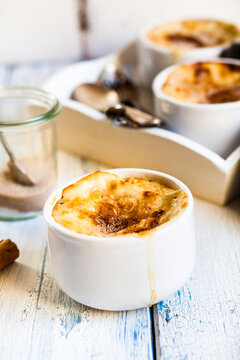 Bowl of Turkish oven baked rice pudding with cinnamon