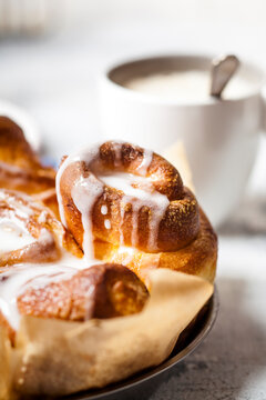 Home-baked cinnamon buns with icing sugar, close-up