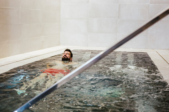 Man floating in a whirlpool in a spa