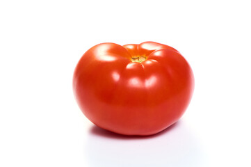 Juicy red tomato on a white isolated background