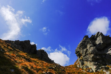 deep blue sky with soft clouds in a colorful mountain landscape