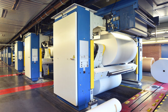 Printing shop: paper roll in a printing press