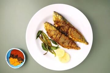  Indian Mackerel fish fry. Bangda Rava fry. whole Fried fish served on a banana leaf with fried...