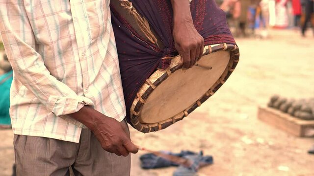 Kolkata, India : Close up of  traditional Dhakis (drummers) playing Dhaak during Kola bou snan (bathing of banana branch) during Durga puja festival in Bengal. Slow motion shot.