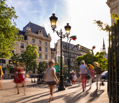 Tourists walking on city street in Paris, France