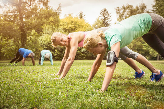 Pushups on a meadow in a park
