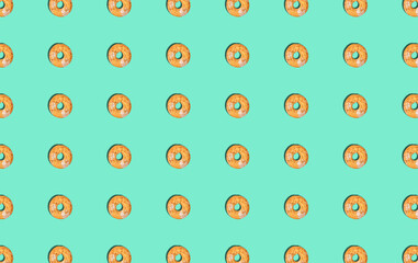 Drawing with shortbread rings and nuts on a turquoise background.