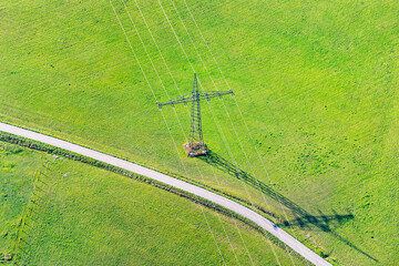 Germany, Baden-Wuerrttemberg, Lake Constance, Markdorf, transmission line on field, aerial view