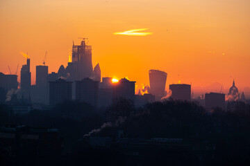 UK, England, London, City skyline at moody sunrise