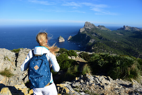 Female hiker enjoying view from Cap Formentor, Balearic Islands, Spain