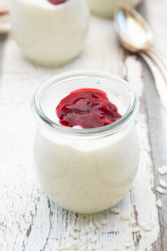 Glass of rice pudding with berry compote