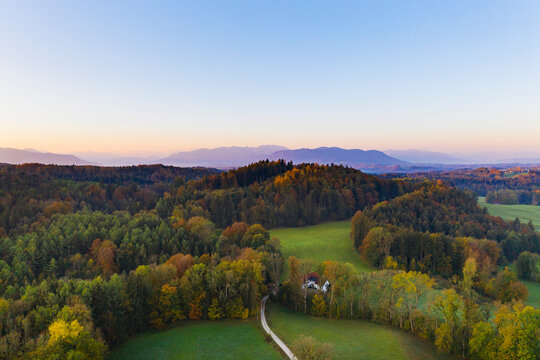 Germany, Upper Bavaria, Toelzer Land, Bavarian Prealps, Dietramszell, Zeller Wald, Aerial view of forest in autumn at sunrise