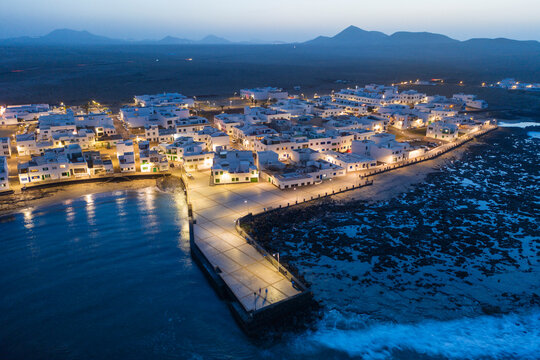 Spain, Canary Islands, Lanzarote, Caleta de Famara, dusk, aerial view
