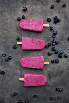 Row of four blueberry popsicles