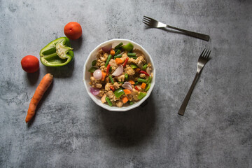Stir fry chicken and vegetables in a bowl. Top view.