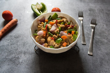 Close up of Stir fry chicken and vegetables in a bowl. Selective focus.