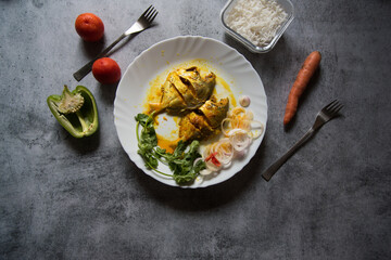 Indian style cooked fish in mustard sauce. Top view