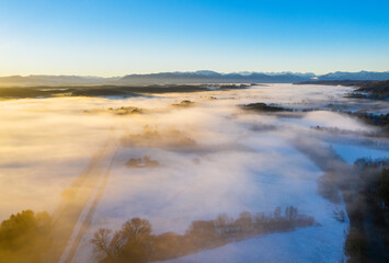 Germany, Bavaria, Loisach, sunrise over winter landscape, aerial view