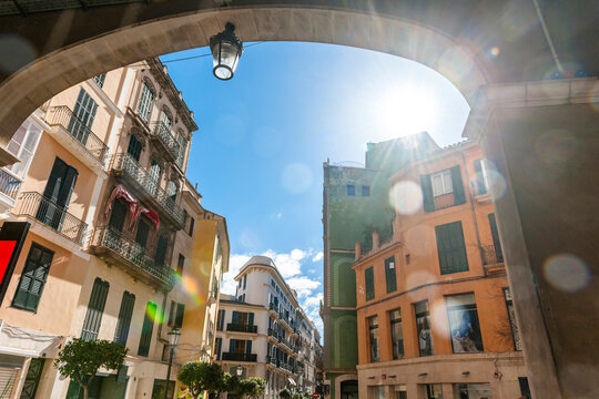 Spain, Mallorca, Palma de Mallorca, City street illuminated by sunlight