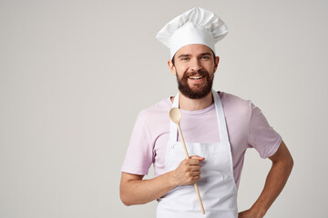male baker with fresh bread in his hands cooking baking