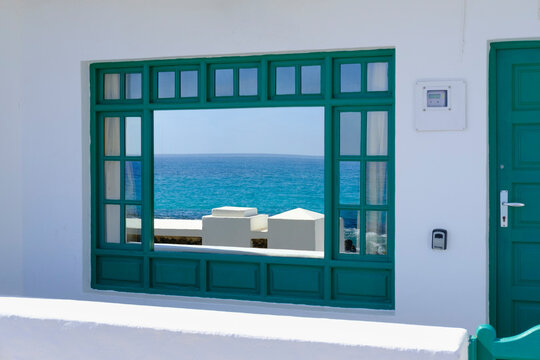 Spain, Canary Islands, Punta Mujeres, Atlantic Ocean reflecting in shiny window