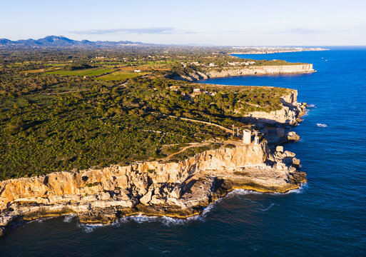 Spain, Balearic Islands, Santanyi, Aerial view of coastal cliffs and Torre den Beu
