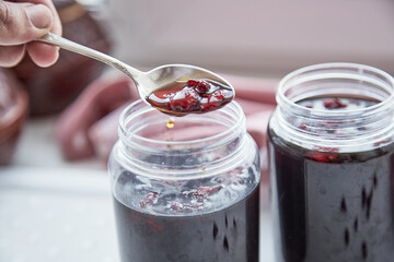 Healthy fermented honey product with cranberry. Food preservative at home, cozy, rustic flat lay. Delicious recipe concept. Anti-viral food