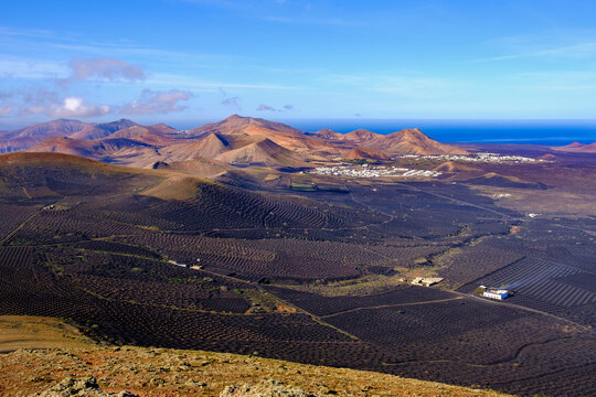 Spain, Canary Islands, Lanzarote, La Geria region, Vineyards and hills