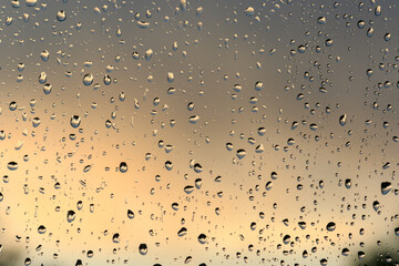 Naklejka na ściany i meble water droplets raindrops on a window
