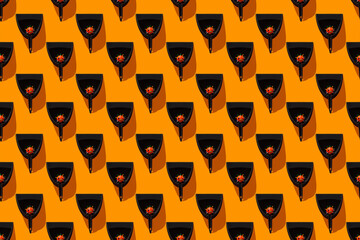 Pattern of dustpans withÔøΩthumbtackedÔøΩbasketballs resembling virus cells