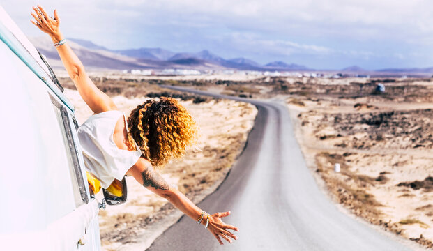 Woman leaning out the window of a van, Fuerteventura
