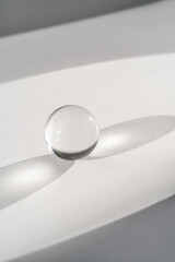 Transparent crystal ball on a white background.