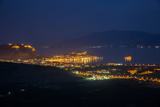 Greece, Nafplio, townscape with Palamidi fortress at blue hour