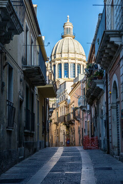 View from an old town alley to Duomo di San Giorgio, Ragusa Ibla, Ragusa, Sicily, Italy