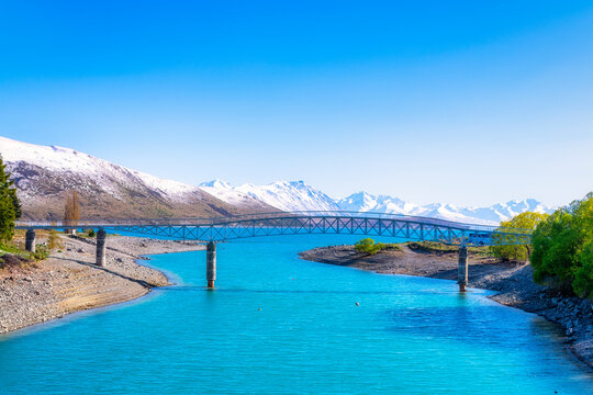 Bridge over Lake Tekapo against blue sky, Tekapo, South Island, New Zealand